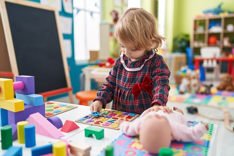 benefits-of-indoor-play-toddler-playing-pretend-doctor